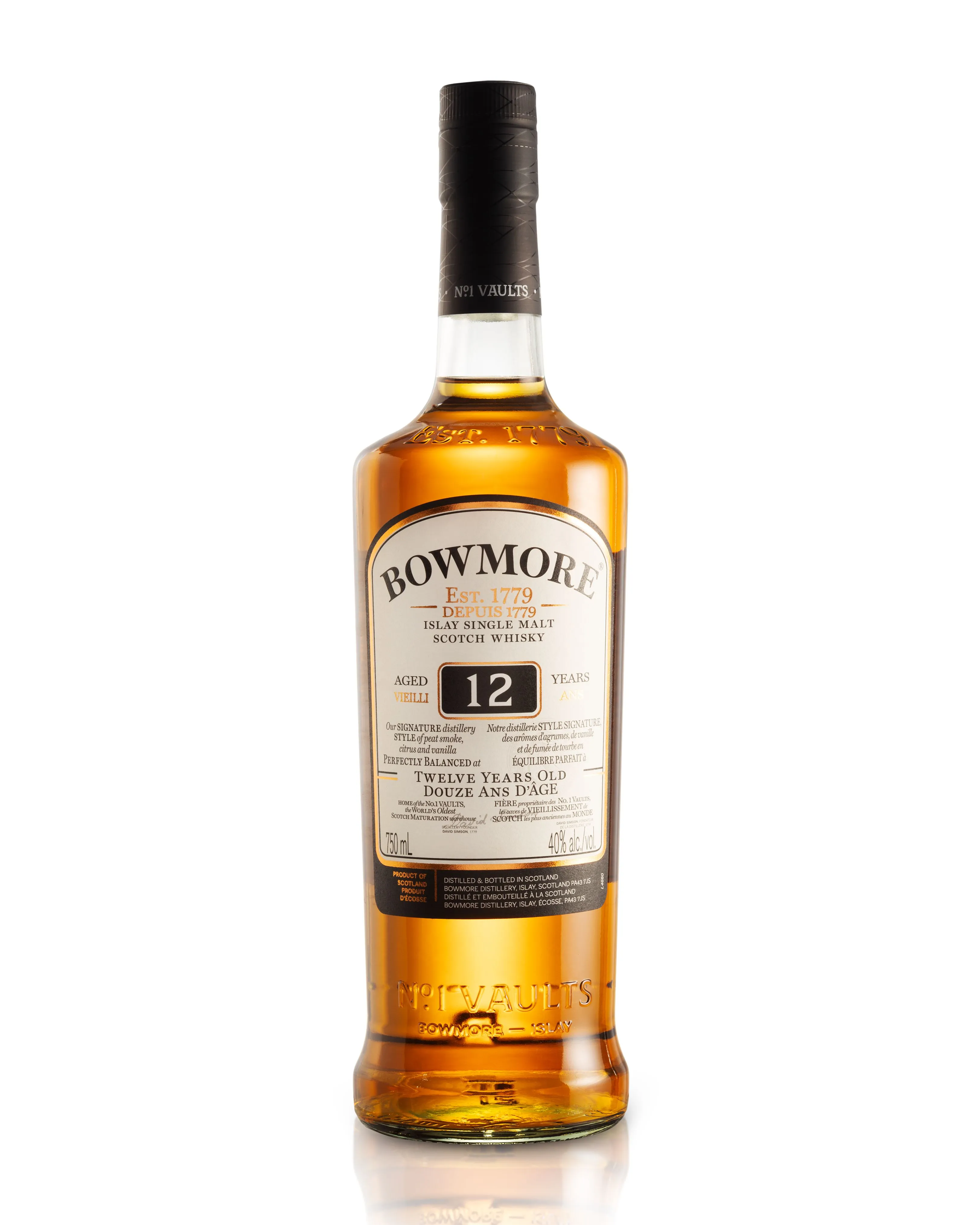 A bottle of Bowmore 12 Year Old Islay Single Malt Scotch Whisky with a black cap, a white label, and an amber liquid inside, set against a white background with a glossy reflection.